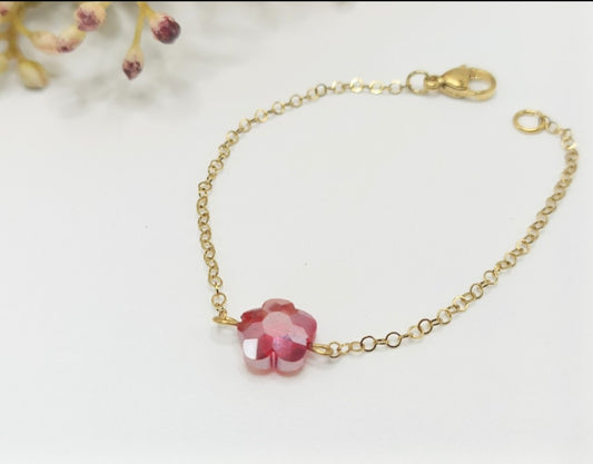 Bracelet doré et fleur rouge en cristal