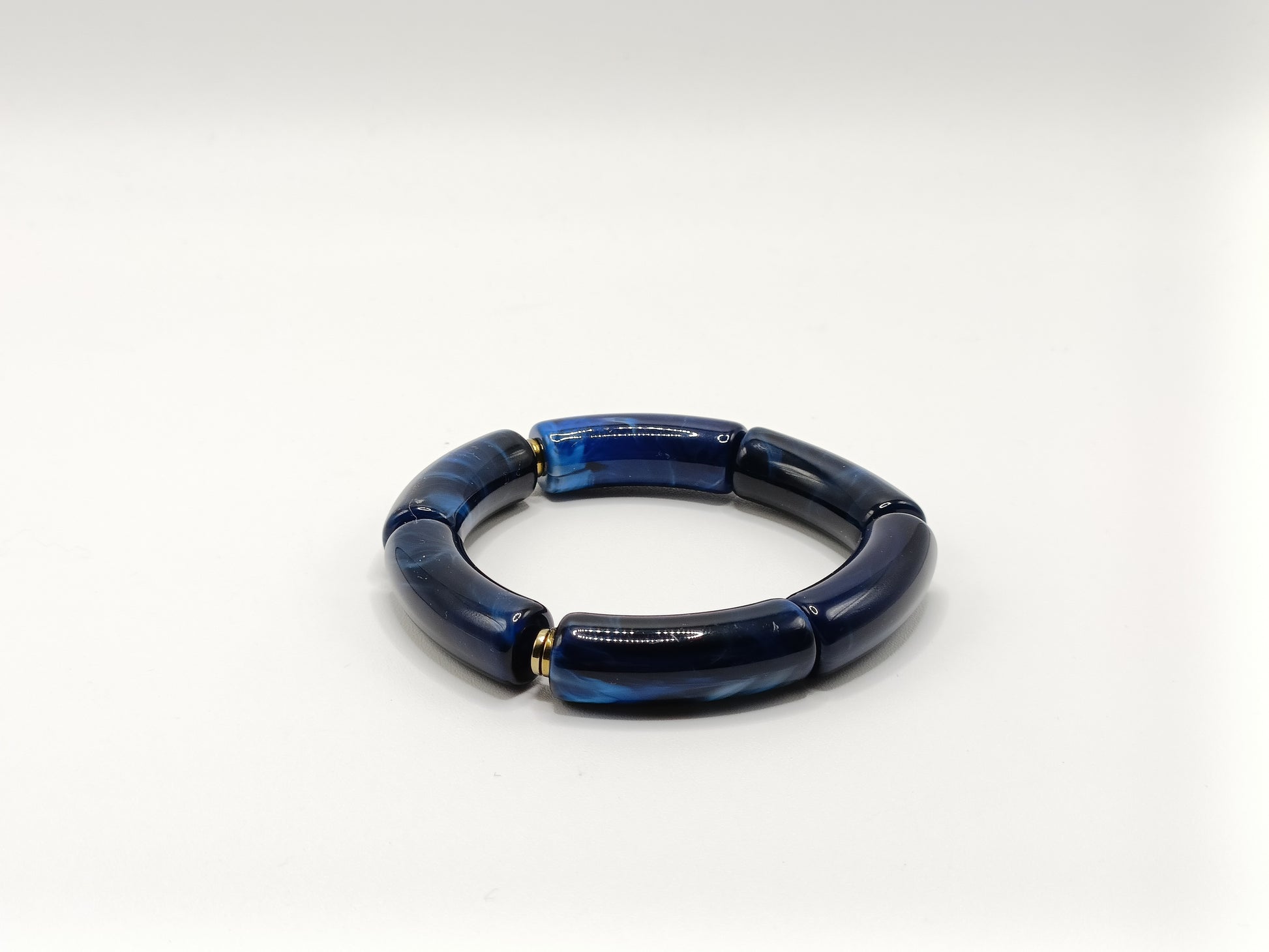 Bracelet tubes XL élastiqués bleu marine marbré et rondelles dorées en hématite